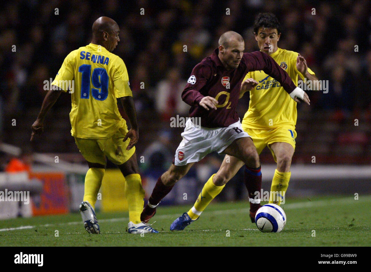 Soccer - UEFA Champions League - Semi-Final - First Leg - Arsenal v Villarreal - Highbury. Arsenal's Fredrik Ljungberg goes past and Villarreal's Marcos Senna and Javi Venta Stock Photo