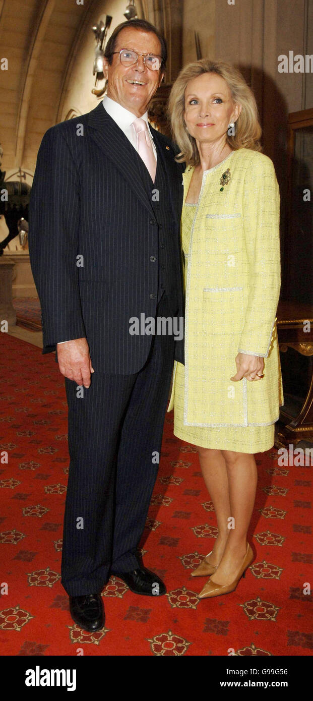 Sir Roger Moore and wife, KiKi arrive at the the Help The Aged Living Legend award hosted by Queen Elizabeth II at Windsor Castle. Stock Photo