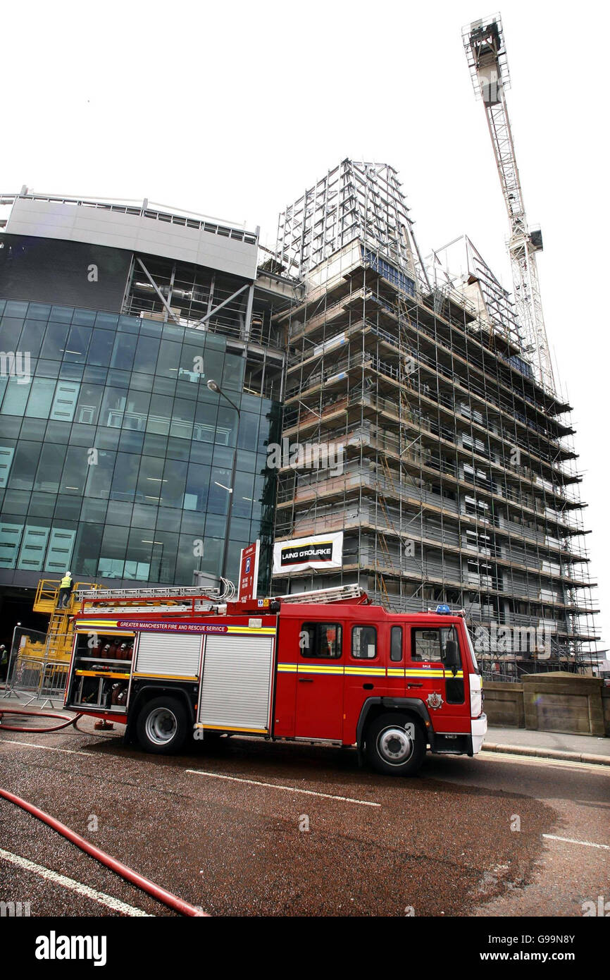 FIRE United Manchester. Firemen attend a blaze at Manchester United's Old Trafford football ground. Stock Photo