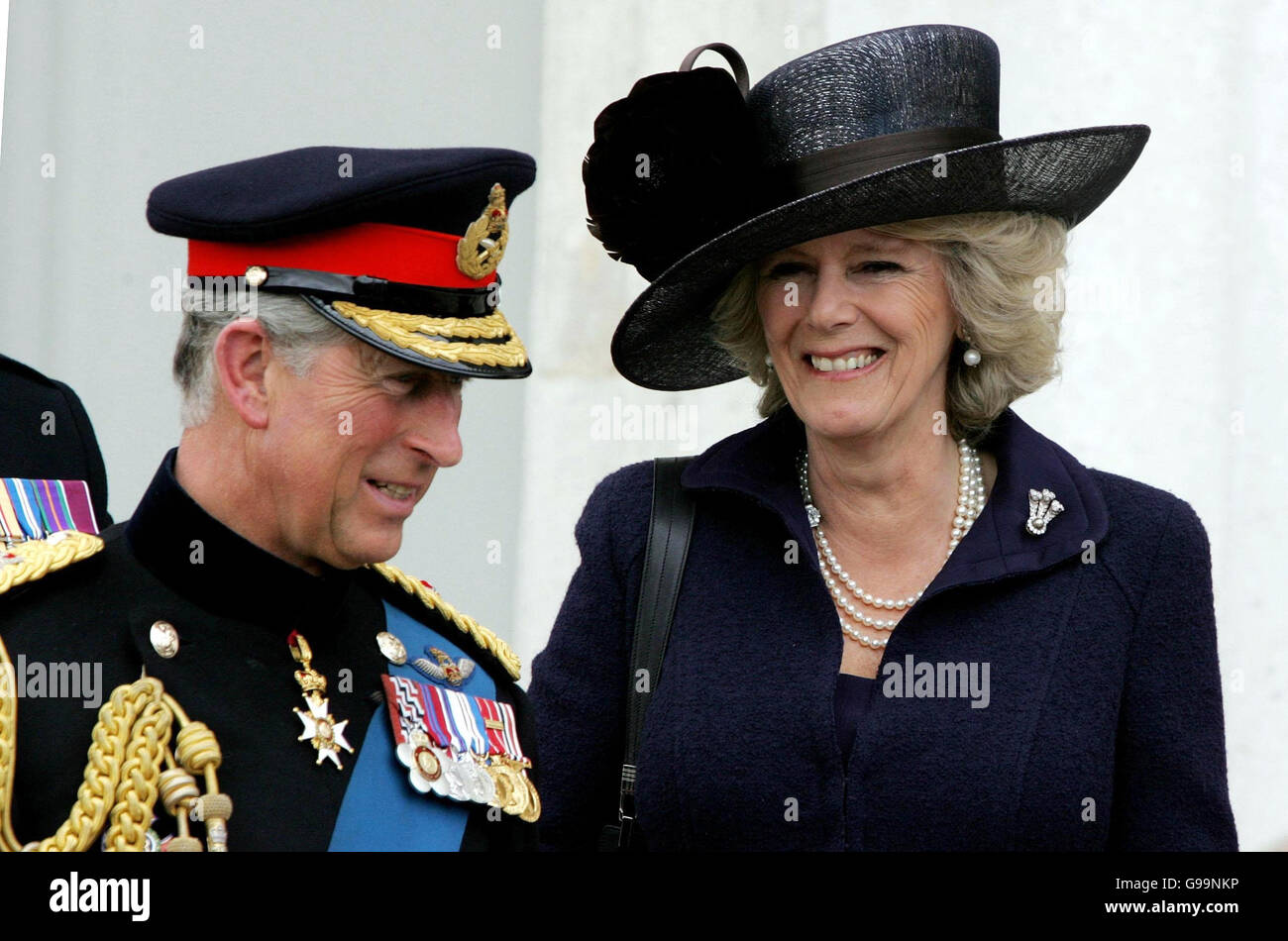 The Prince of Wales and the Duchess of Cornwall at Sandhurst Royal Military Academy after The Sovereign's Parade that marked the completion of Prince Harry's Officer training. PRESS ASSOCIATION Photo Picture date: Wednesday April 12, 2006. The Prince was one of 220 cadets passing out and receiving their commissions into the British Army. See PA story ROYAL Harry. Photo credit should read: Tim Ockenden / PA. Stock Photo
