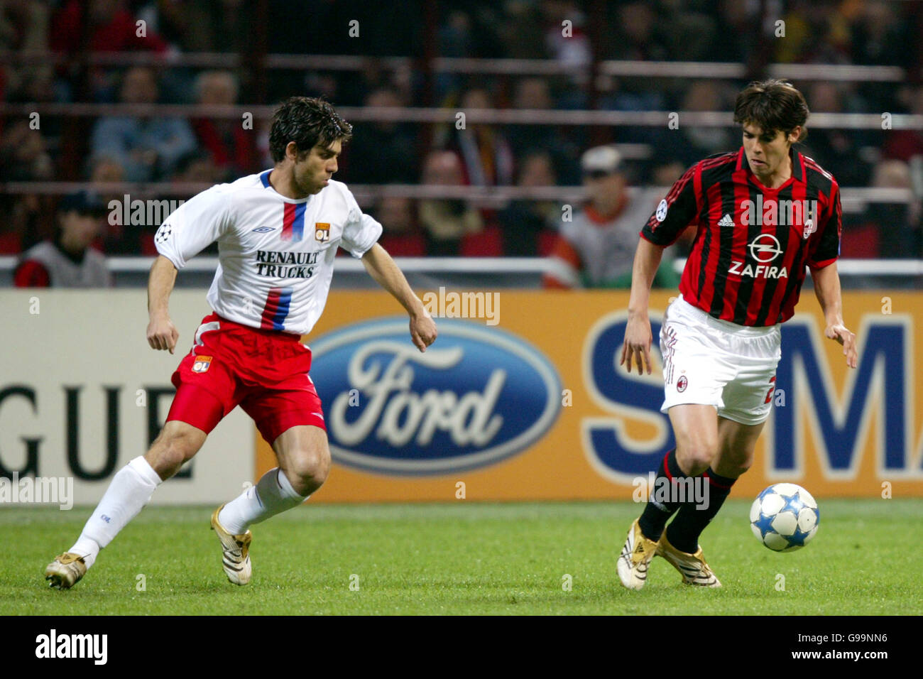 AC Milan's Kaka and Olympique Lyonnais' Juninho Pernambucano battle for the ball Stock Photo