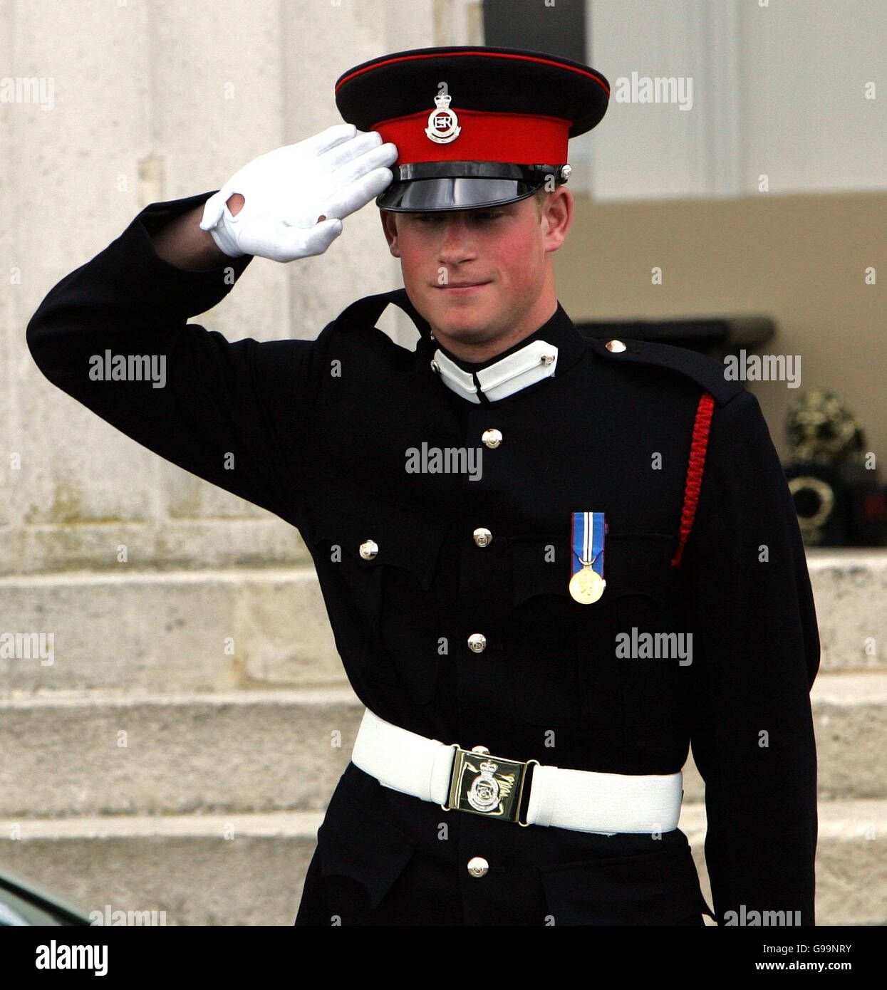 Prince Harry salutes The Prince of Wales as he leaves Sandhurst Royal Military Academy after The Sovereign's Parade that marked the completion of Prince Harry's Officer training. PRESS ASSOCIATION Photo Picture date: Wednesday April 12, 2006. The Prince was one of 220 cadets passing out and receiving their commissions into the British Army. See PA story ROYAL Harry. Photo credit should read: Tim Ockenden / PA. Stock Photo