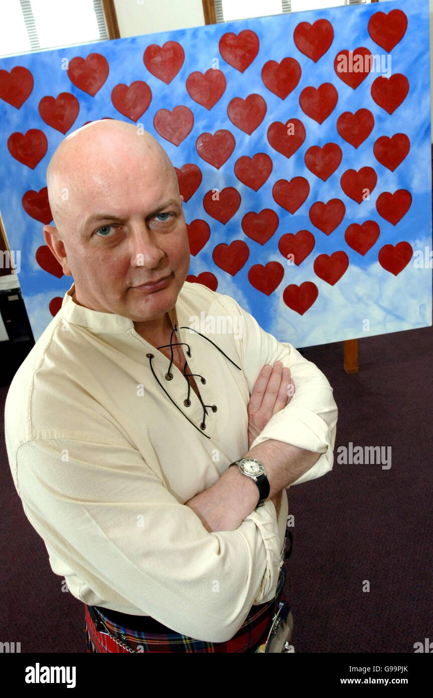 Artist John Bray stands by his painting which he has given to London