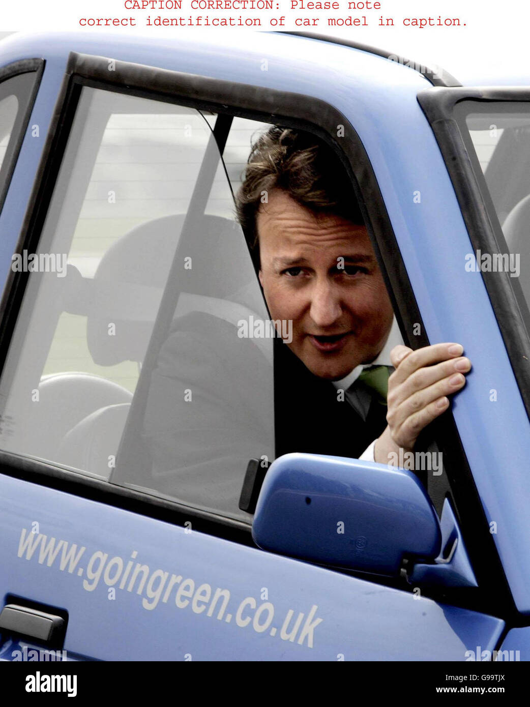 Conservative Party leader David Cameron drives a Reva G-Wiz electric car at Dunsfold Park airfield in Cranleigh, Surrey where he committed his party to slashing carbon emissions from cars on British roads by almost a third to help the fight against global warming. Stock Photo