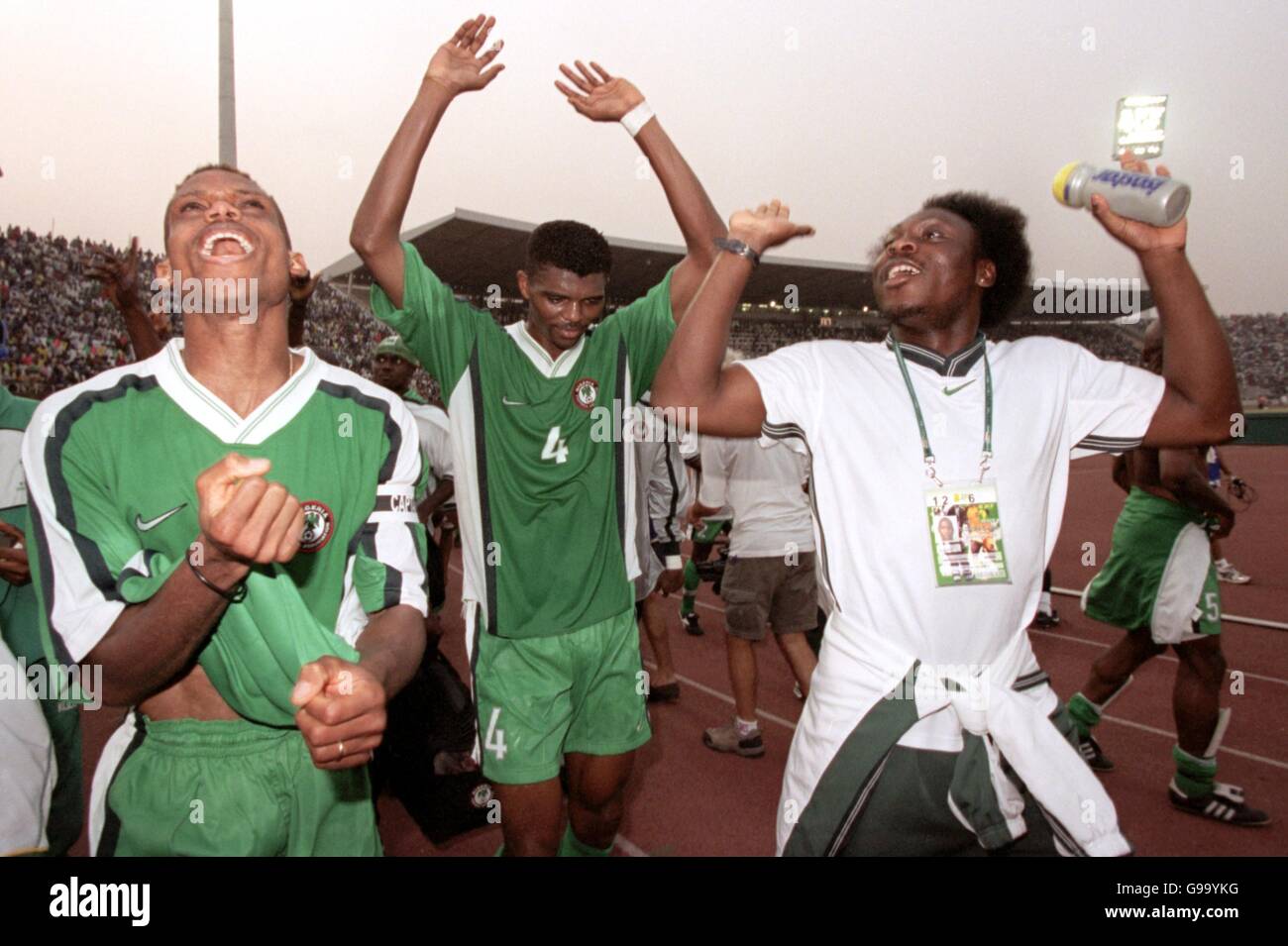 Nigeria captain Sunday Oliseh (l), Nwankwo Kanu (c) and Daniel Amokachi (r) celebrate gaining a place in the final after their 2-0 defeat of South Africa Stock Photo
