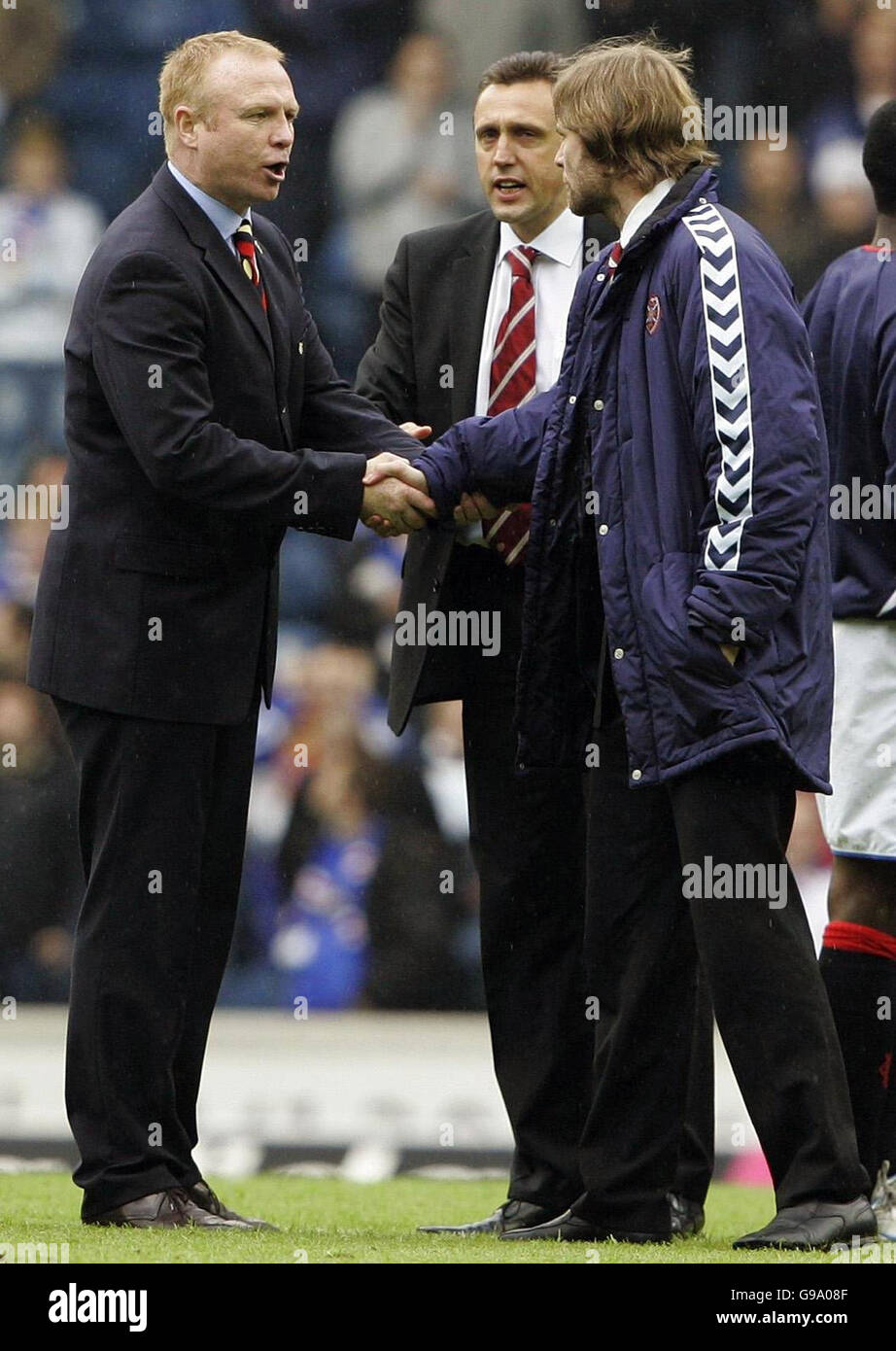 Rangers Manager Alex McLeish (L) shakes hands with Hearts captain ...
