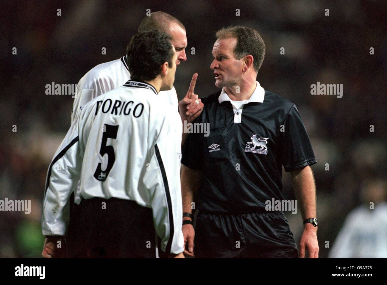 Derby County's Spencer Prior (hidden) and Tony Dorigo (left) argue with