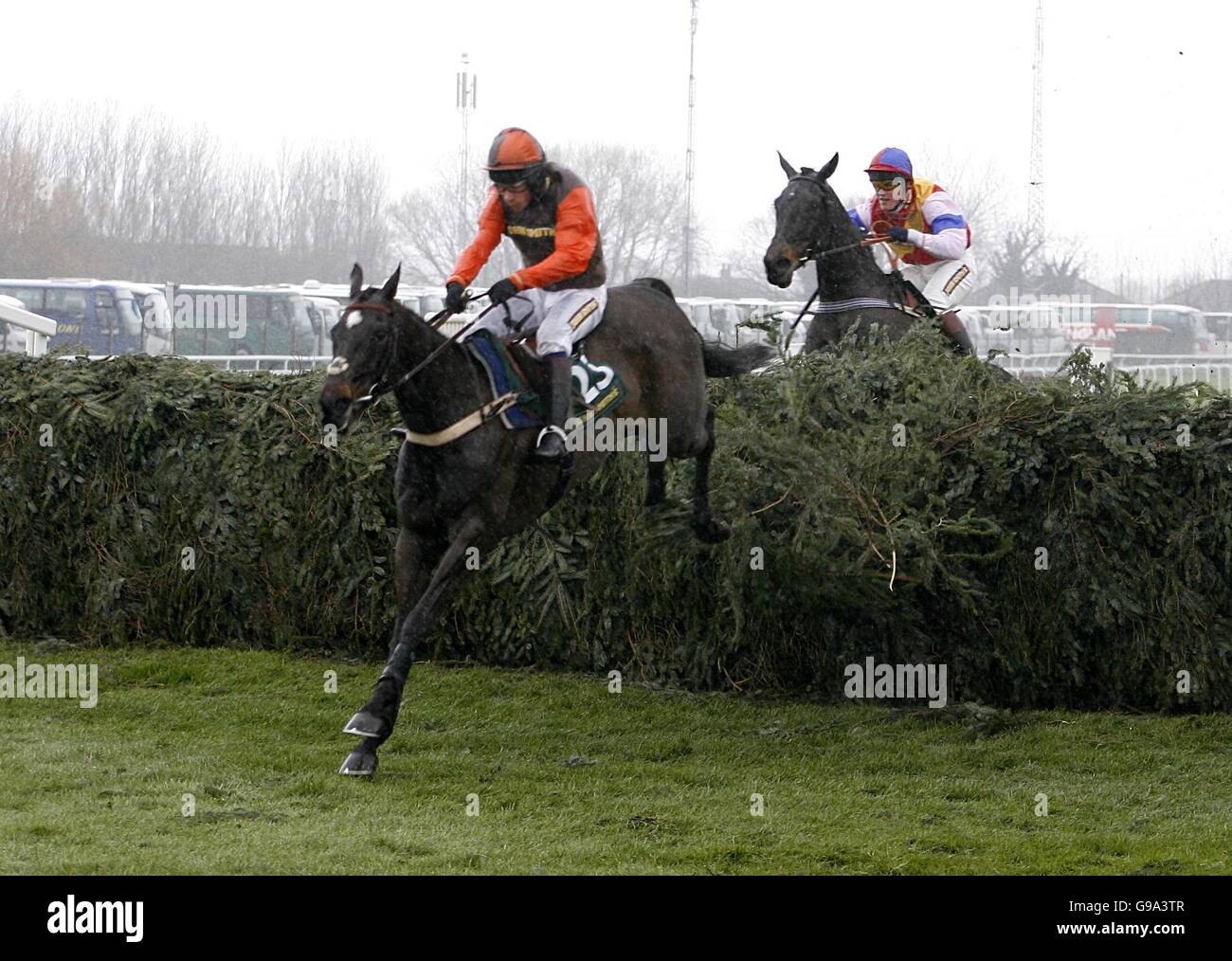 Katarino ridden by Mr Sam Waley-Cohen (l) jumps the last before winning from Christy Beamish and Mr William Hill in the John Smith's Fox Hunters' Steeple Chase (Class 2) Stock Photo