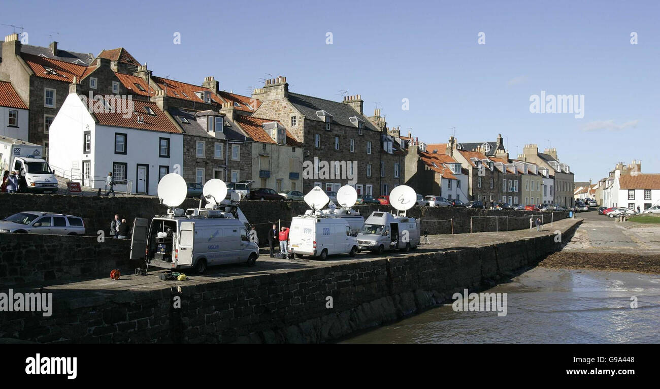 Satellite news vans are parked in Cellardyke Harbour in Fife, Scotland, Thursday April 6, 2006, where samples from a dead swan found in the small coastal town tested positive for 'highly pathogenic H5 avian flu'. Scientists are now waiting to see if the strain was the deadly H5N1, which can be fatal to humans if they come into close contact with birds. See PA story HEALTH BirdFlu. Stock Photo