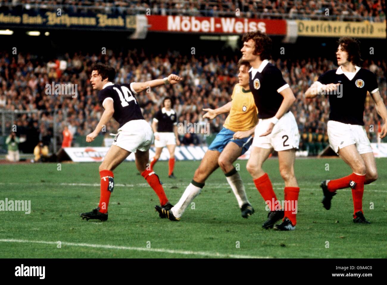 l-r Martin Buchan, Sandy Jardine and Jim Holton all Scotland watch as Brazil's Leivinha goes close Stock Photo