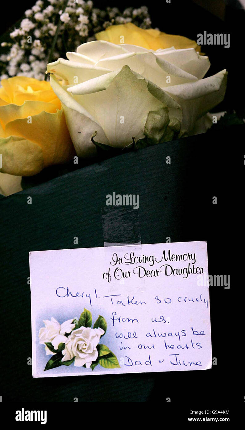 Floral tributes placed near the the scene of the murder of Cheryl Moss in the grounds of St George's Hospital, Hornchurch in Essex, Friday April 7, 2006. Extra security staff are on duty at the hospital where Cheryl Moss, 33, was killed yesterday morning as she took a mid-morning cigarette break. See PA Story POLICE Nurse. Stock Photo