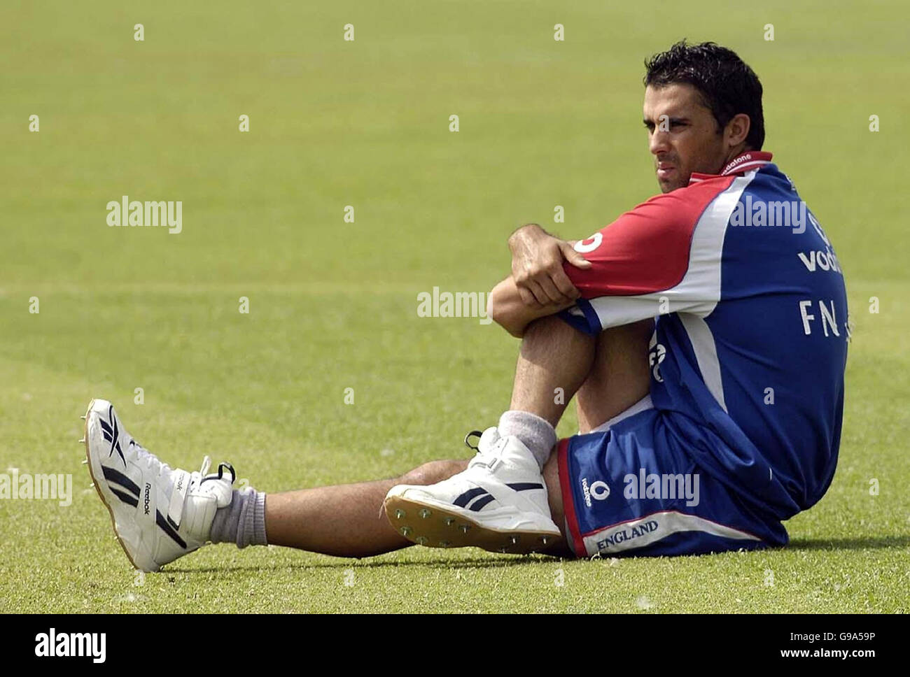 England's Kabir Ali stretches before a nets session at the Keenan Stadium, Jamshedpur, India. Stock Photo