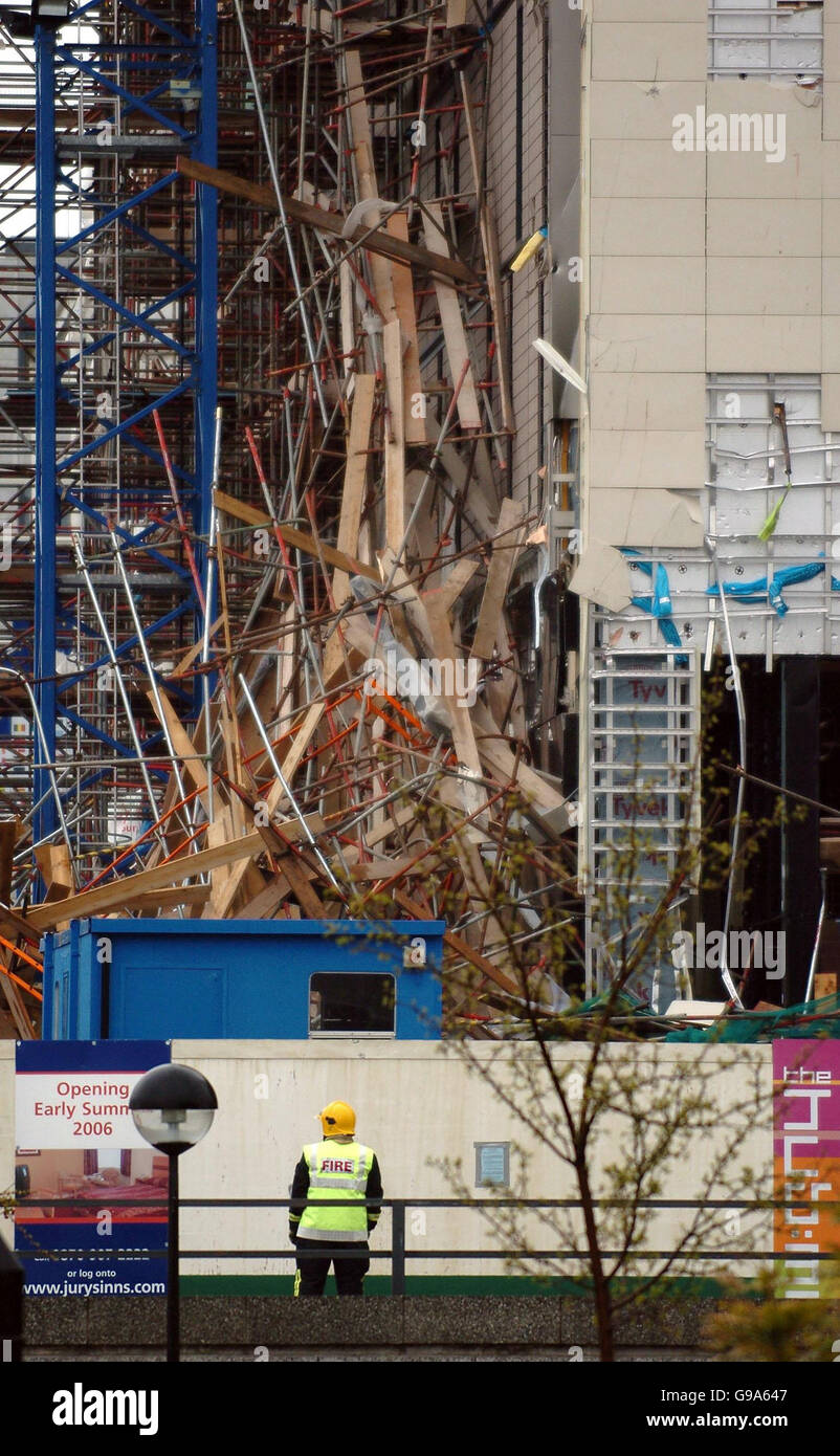 The scene at the partly constructed Jurys Inn Hotel in Witan Gate East, Milton Keynes after 15 floors of scaffolding collapsed. PRESS ASSOCIATION Photo. Picture Date:Tuesday 11 April 2006. Several workers were feared trapped today after 15 floors of scaffolding collapsed 'like a pack of cards' at a hotel building site.' Emergency services rushed to the site of the half-constructed Jurys Inn Hotel in Milton Keynes after the incident at around 12.30pm. A Fire Brigade spokesman said there had been a number of casualties, but they were not sure how many. There were reportedly up to 200 workmen at Stock Photo