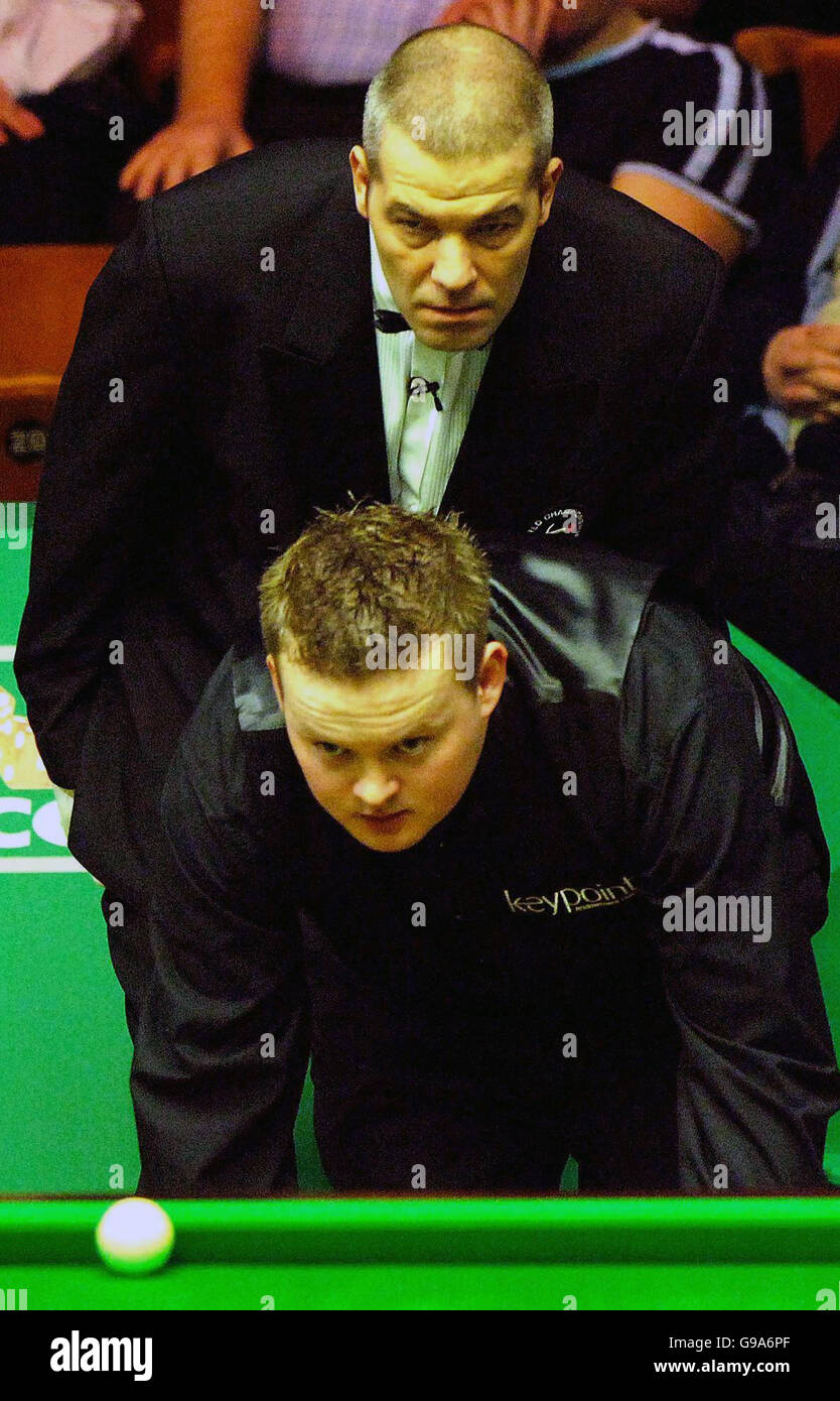 Referee Jan Verhaas watches Shaun Murphy line up a shot during his match against James Wattana during the World Snooker Championship first round match at The Crucible Theatre, Sheffield Stock Photo -