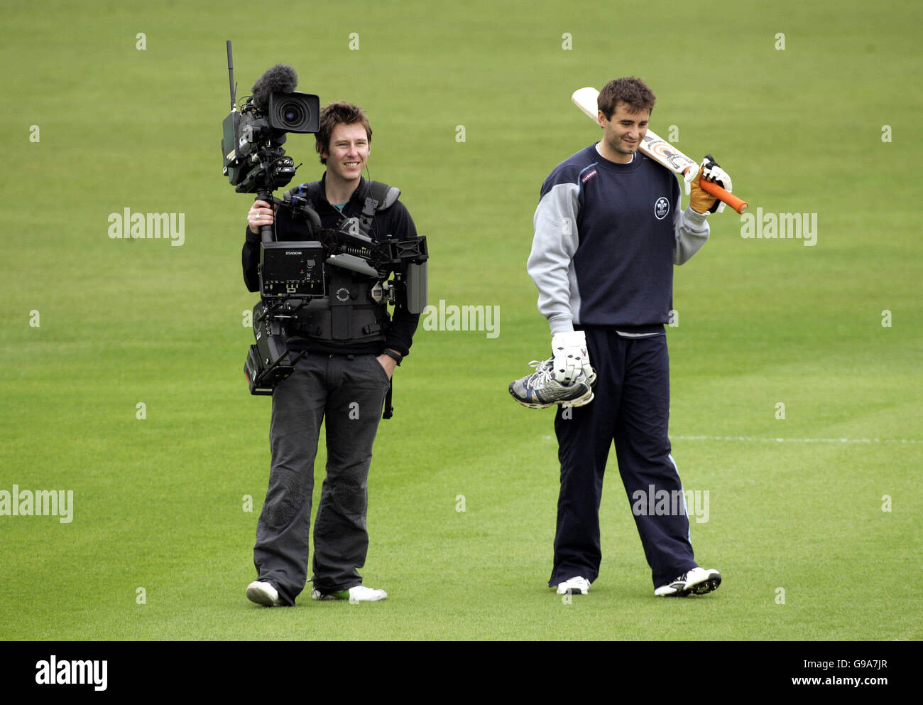 A Sky television cameraman is seen on the pitch at the Brit Oval before
