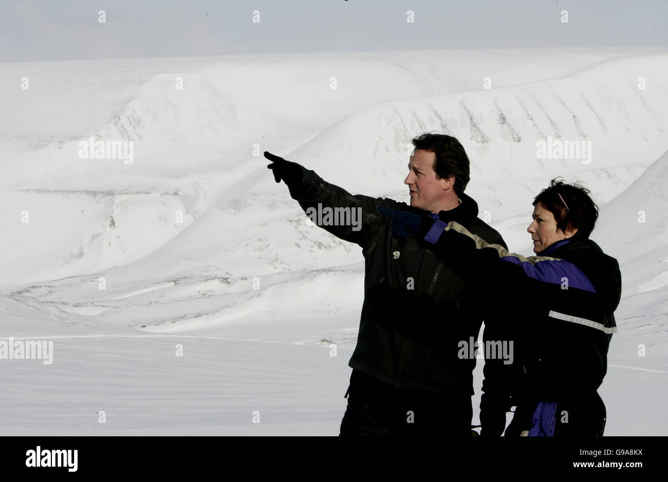 Leader of the Conservative Party David Cameron and Sam Smith Director of WWF'S Arctic Programme on top of the Scott -Turner glacier on the island of Svalbard, Norway. Stock Photo
