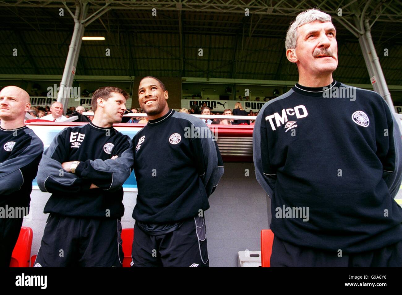 Celtic's management team, (l-r) coach Eric Black, manager John Barnes and assistant manager Terry McDermott, wait for the start of their first league match in charge Stock Photo