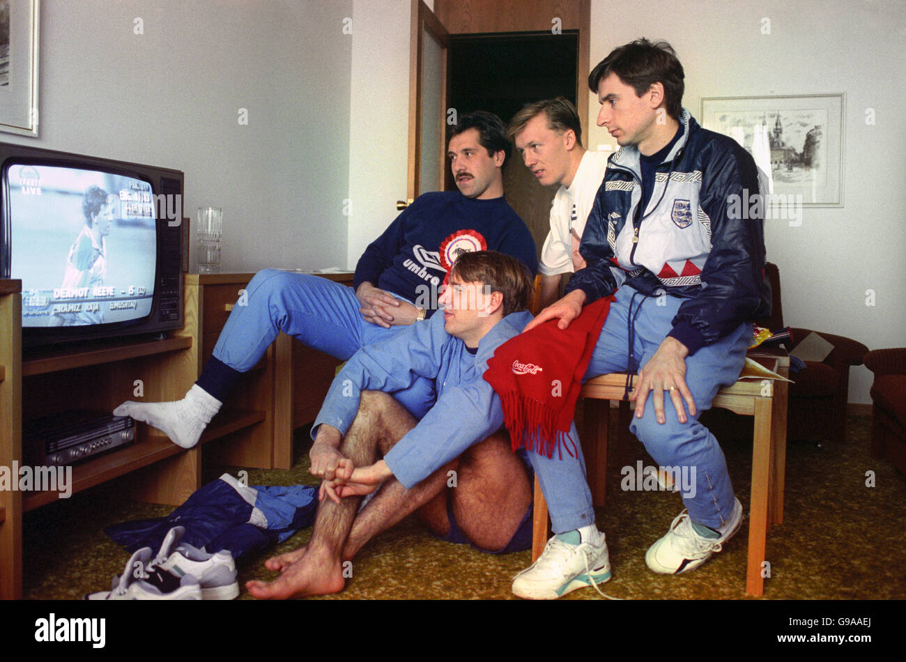 England footballers David Seaman, Paul Merson, Lee Dixon and Alan Smith watch the Cricket World Cup final between England and Pakistan on a television. Stock Photo