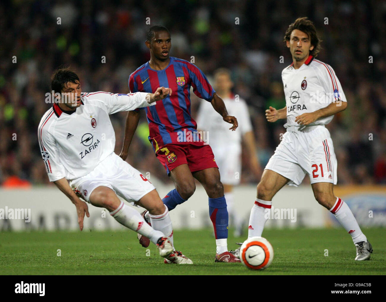Barcelona's Samuel Eto'o (C) in action with AC Milan's Kakha Kaladze (L)and Andrea Pirlo during the Champions League semi-final second leg match at The Nou Camp, Barcelona, Spain. Stock Photo