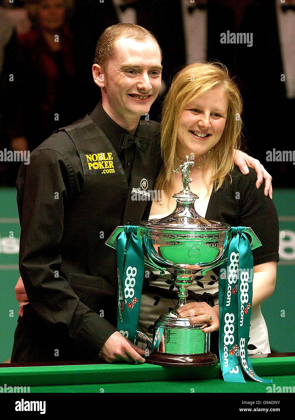 Scotland's Graeme Dott celebrates with his wife Elaine and the trophy after his 18-14 win against England's Peter Ebdon in the Final of the World Snooker Championships at the Crucible Theatre, Sheffield. Stock Photo