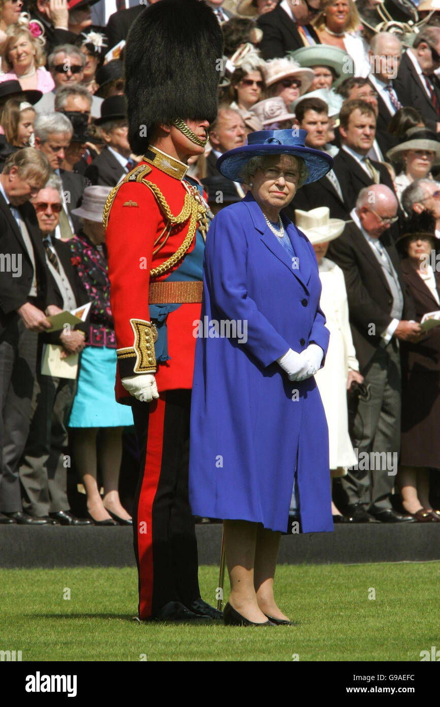 Britain's Queen Elizabeth II stands with Prince Charles, front