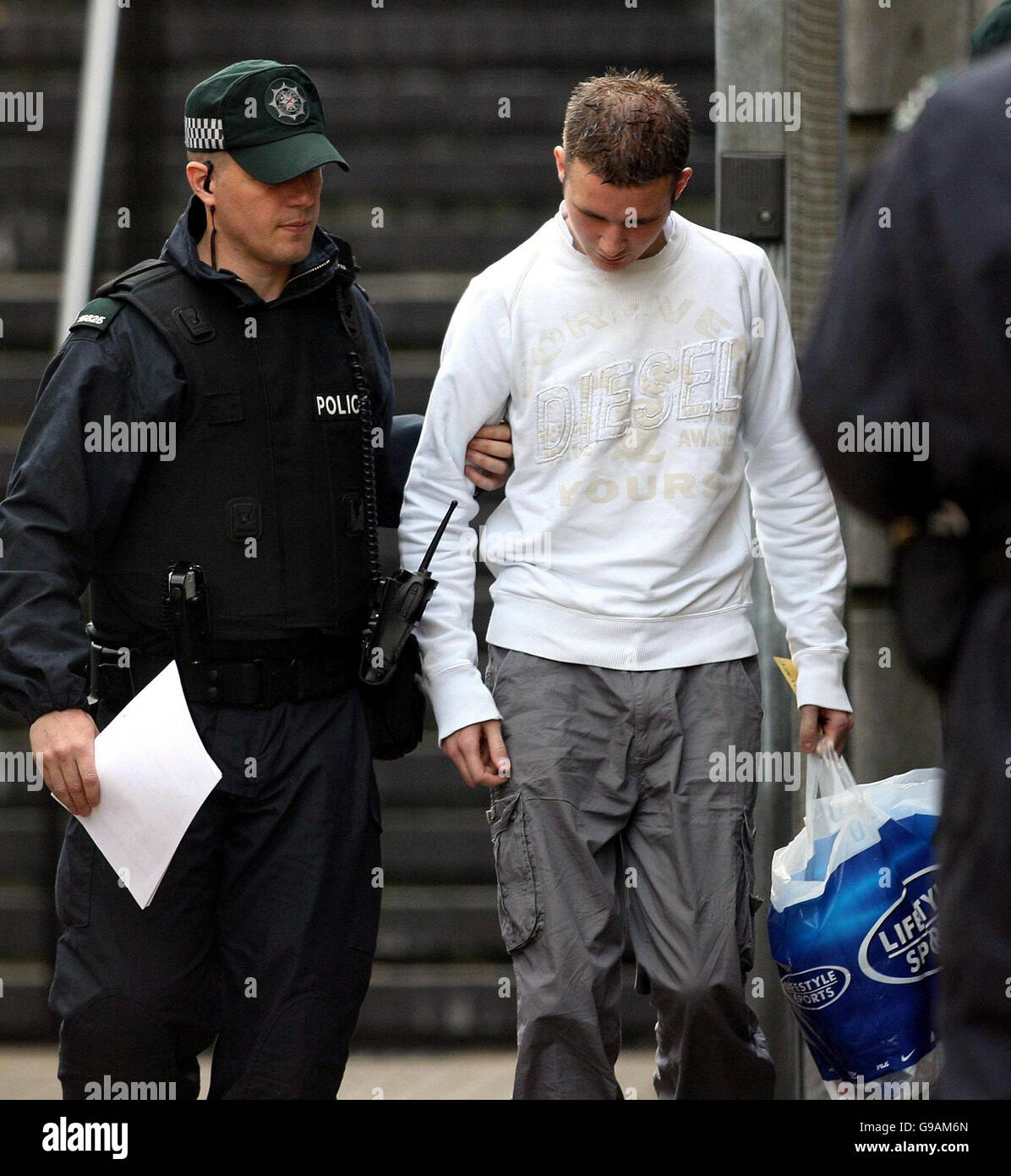 Aaron Wallace is led from Ballymena court after being charged with the murder of Ballymena schoolboy Michael McIlveen. Stock Photo