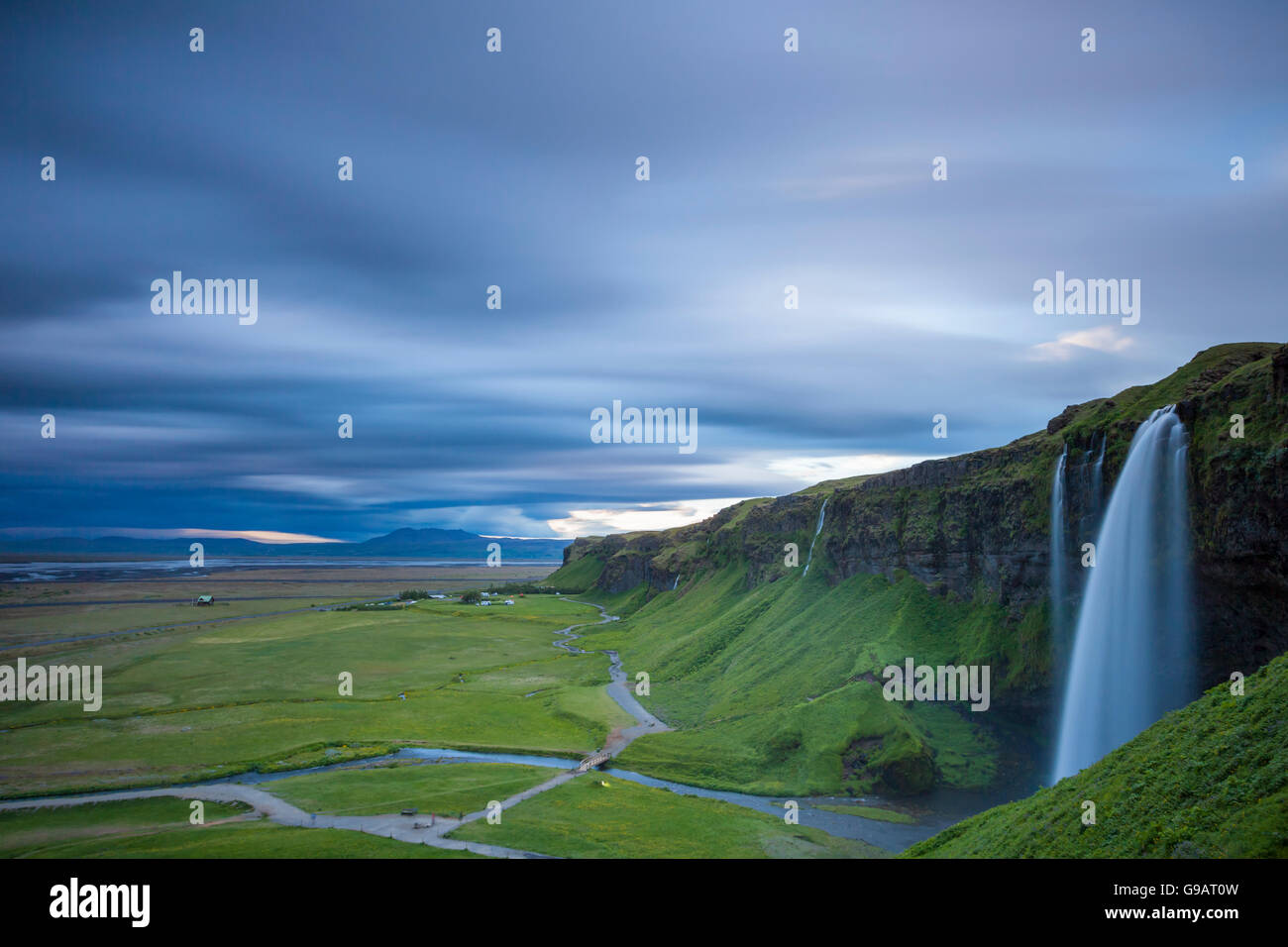 Summer sunset at Seljalandsfoss waterfall, Iceland Stock Photo - Alamy