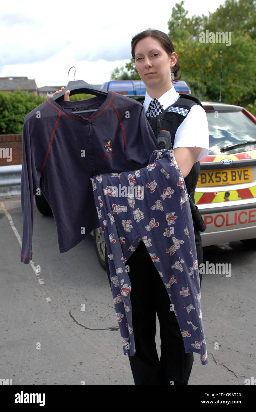 WPC Dawn Shenton with a set of ladies pajamas that were with a newborn baby girl found dead in a plastic bag near a river had suffered several serious injuries, including a fractured skull and collarbone, police said today. Stock Photo