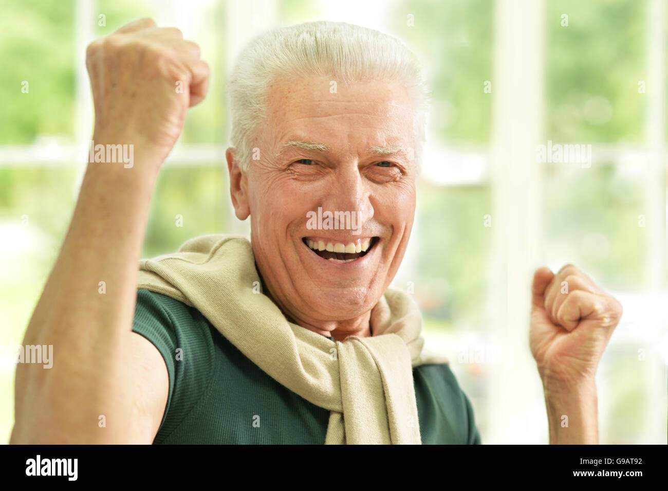 Senior man  with hands up Stock Photo