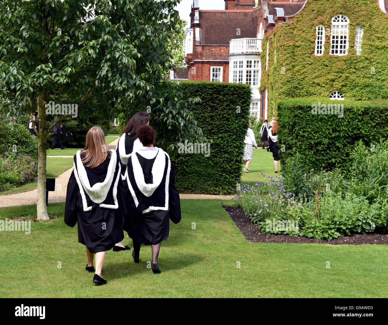 Smiling students celebrates her graduation at Cambridge University