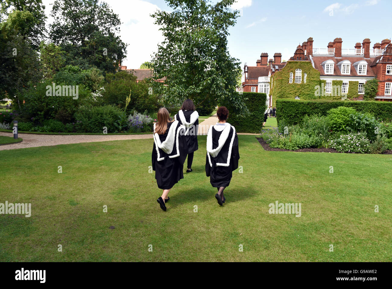 Smiling students celebrates her graduation at Cambridge University