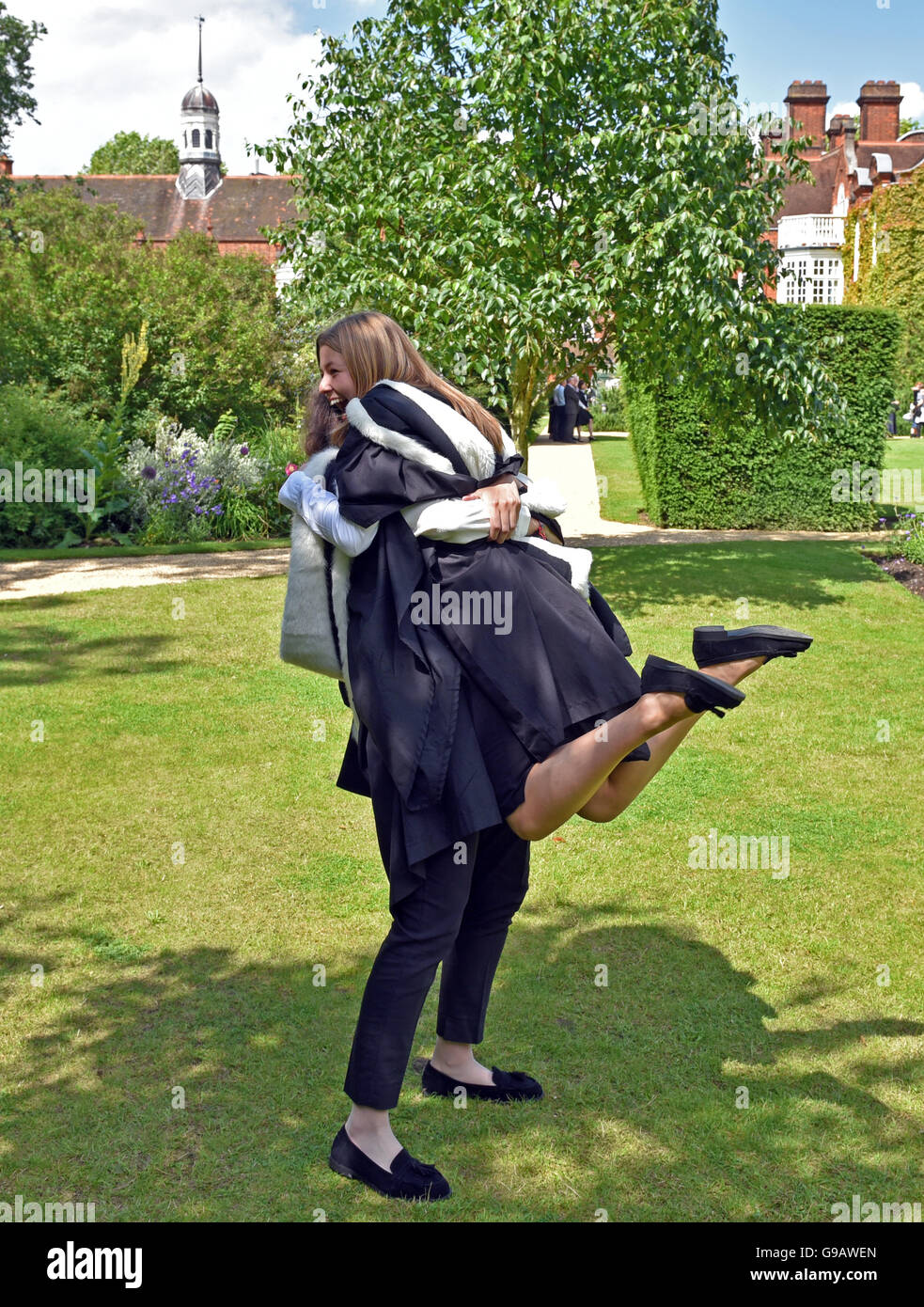 Smiling students celebrates her graduation at Cambridge University