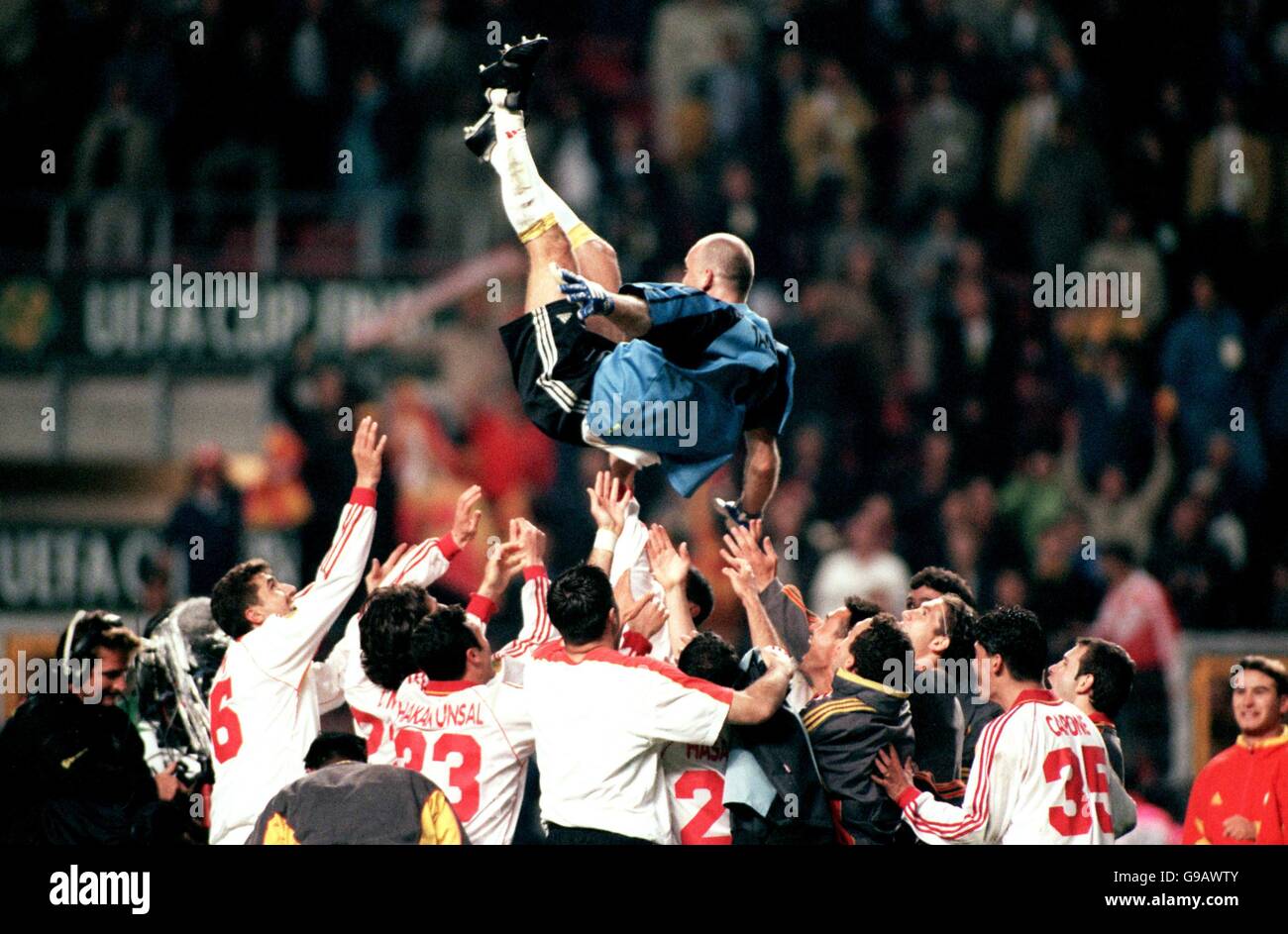 Soccer - UEFA Cup - Final - Galatasaray v Arsenal. Galatasaray goalkeeper Claudio Taffarel is thrown into the air in celebration after their victory Stock Photo