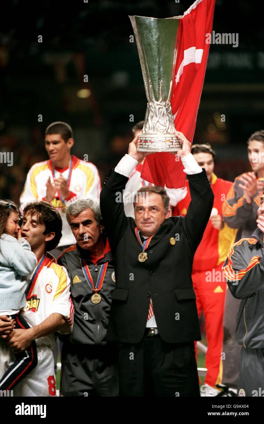 Soccer - UEFA Cup - Final - Galatasaray v Arsenal. Galatasaray manager Fatih Terim celebrates with the UEFA Cup Stock Photo