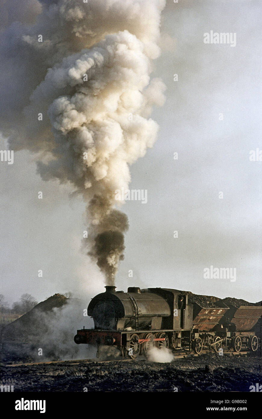 A Hunslet Austerity heads a rake of ladle wagons at Shilbottle Colliery. Stock Photo