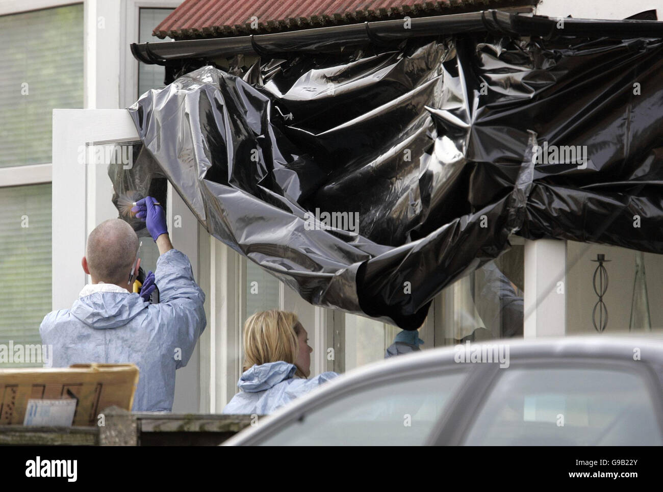 Police forensic officers working at the home of Special Constable Nisha