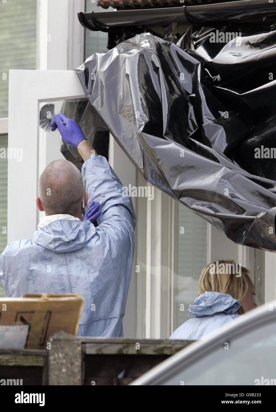 Police forensic officers working at the home of Special Constable Nisha