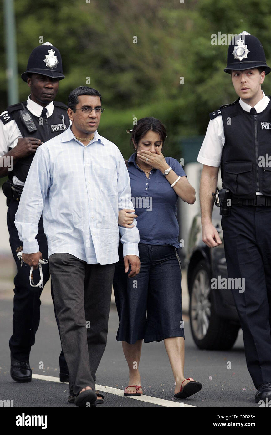 A woman with her partner as she holds flowers in Sudbury Avenue