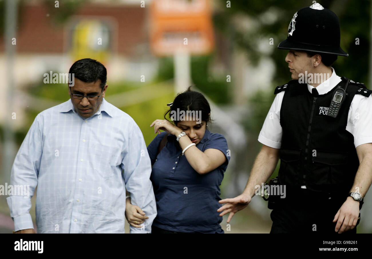 A woman with her partner as she holds flowers in Sudbury Avenue