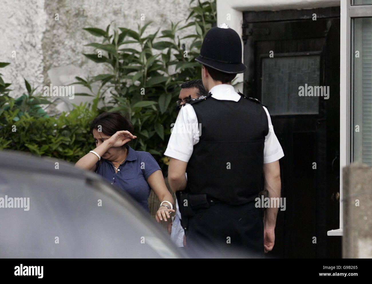 A woman with her partner as she holds flowers in Sudbury Avenue