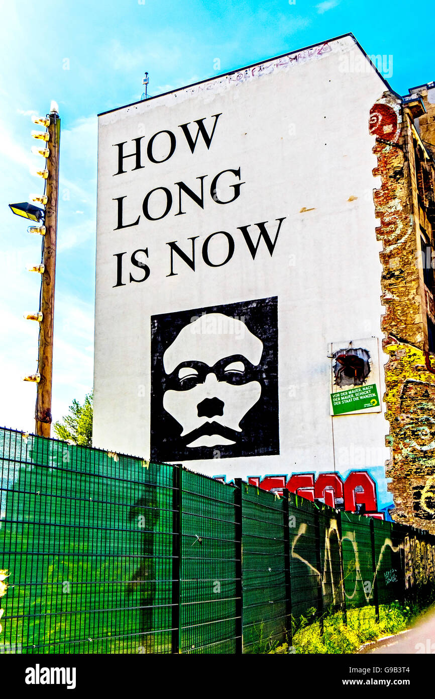 Berlin, painting on a wall; how long is now Stock Photo