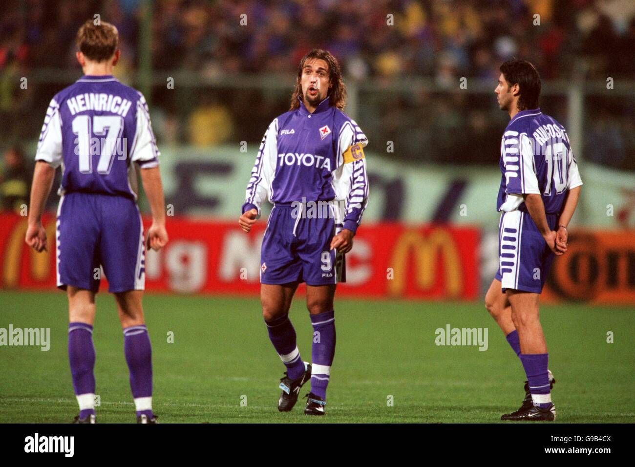 Fiorentina's Gabriel Batistuta (c) berates teammate Jorg Heinrich (l), watched by Rui Costa (r) Stock Photo