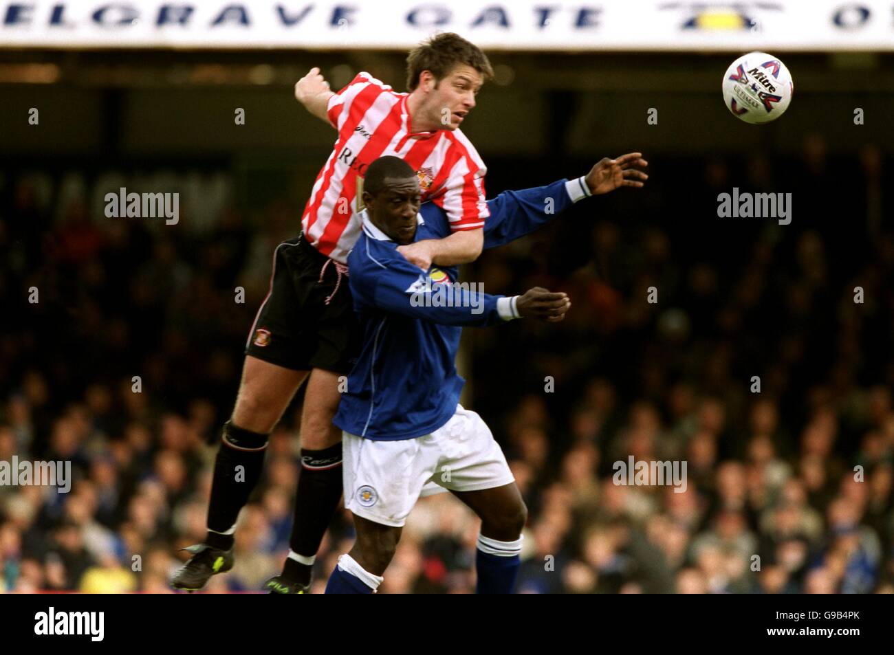 Sunderland's Paul Butler (l) heads clear from Leicester City's Emile Heskey (r) Stock Photo