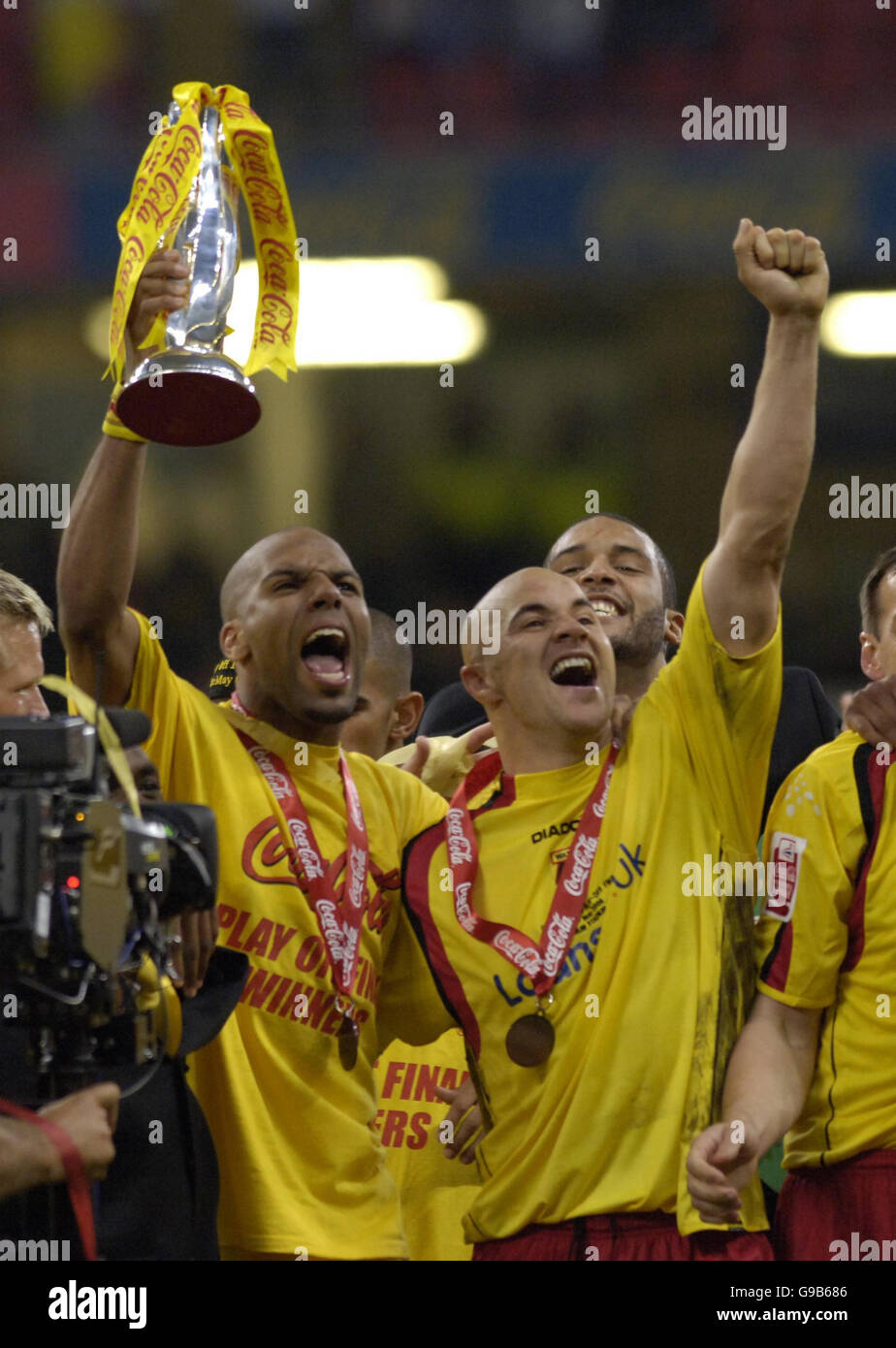 Watford Marlon King (L) celebrates with the trophy with captain Gavin