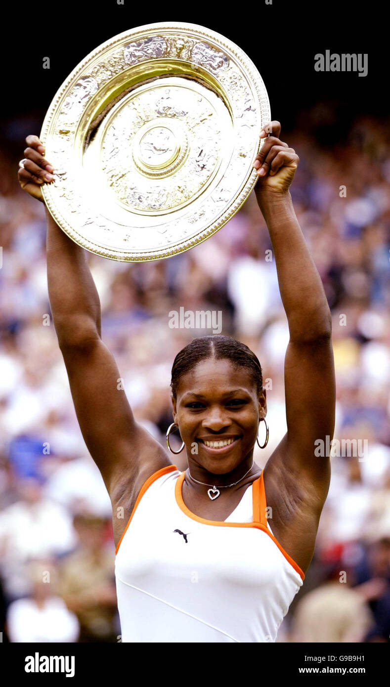 Library FILER dated 05/07/2003 of USA's Serena Williams raises the trophy after winning the ladies singles final. Stock Photo