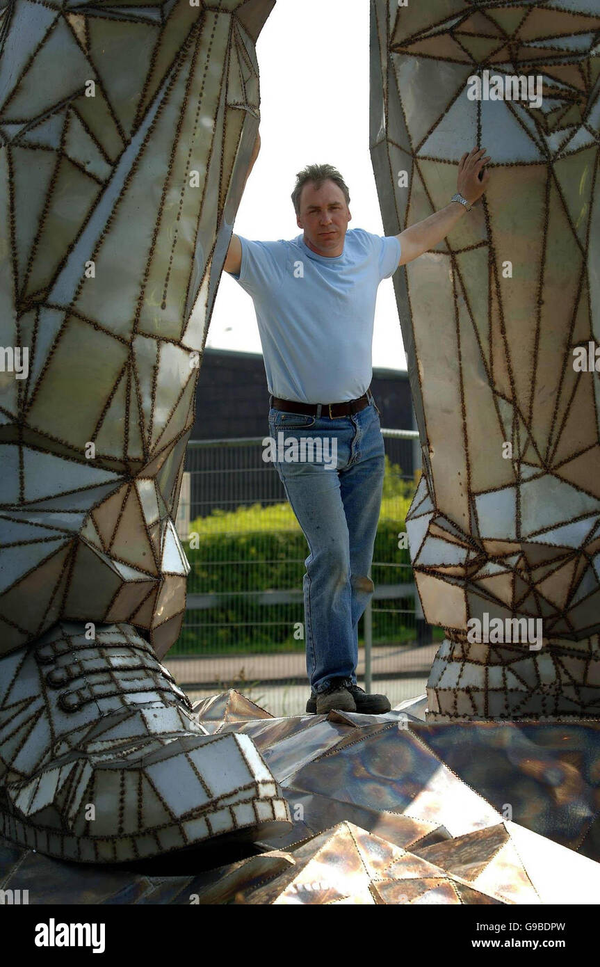 John mckenna beneath 30 feet tall sculpture 19th century miner hires