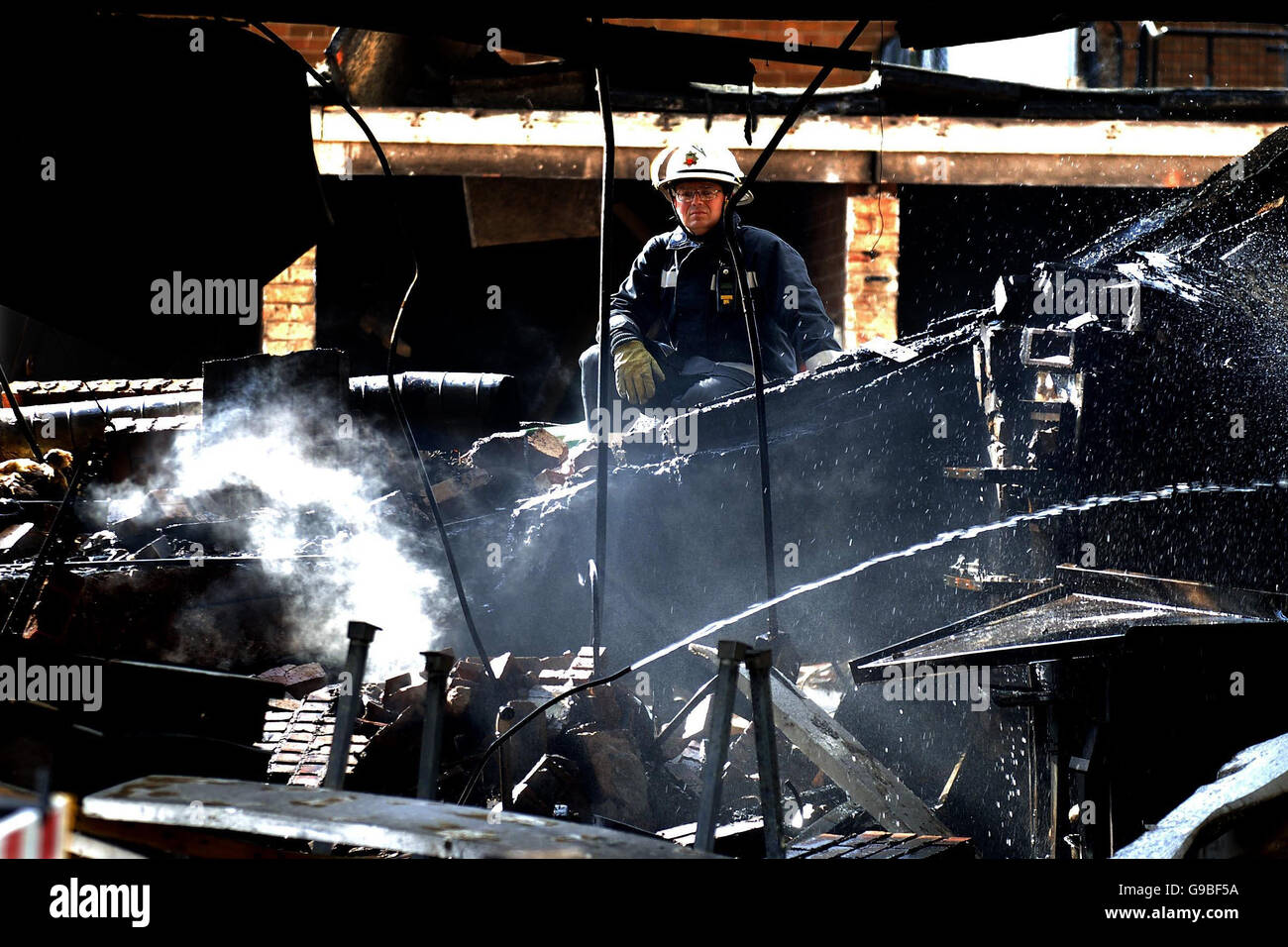 A firefighterfrom Humberside Fire and Rescue Service looks at the scene