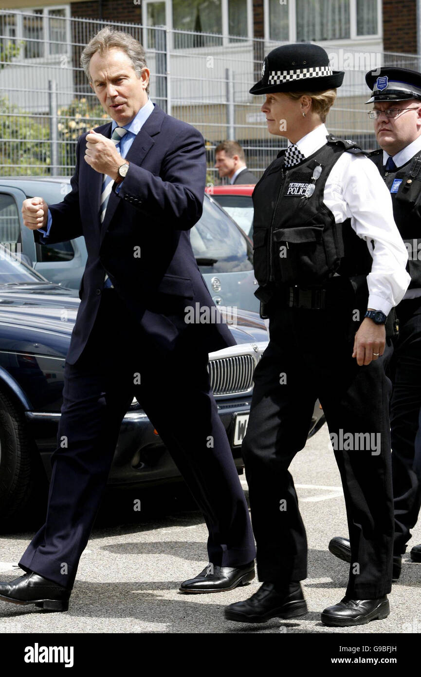 Police Sergeant Sarah Ward shows British Prime Minister Tony Blair around the Church Manor Estate in south London, where he visited a former crack house. Stock Photo