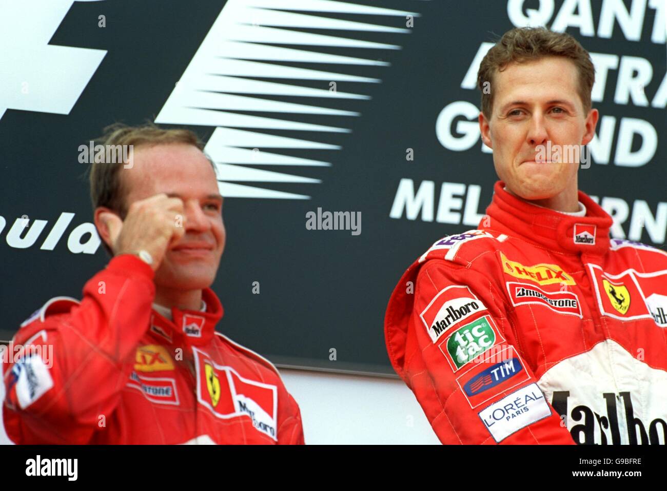 Happy race winner Michael Schumacher r with an emotional Rubens