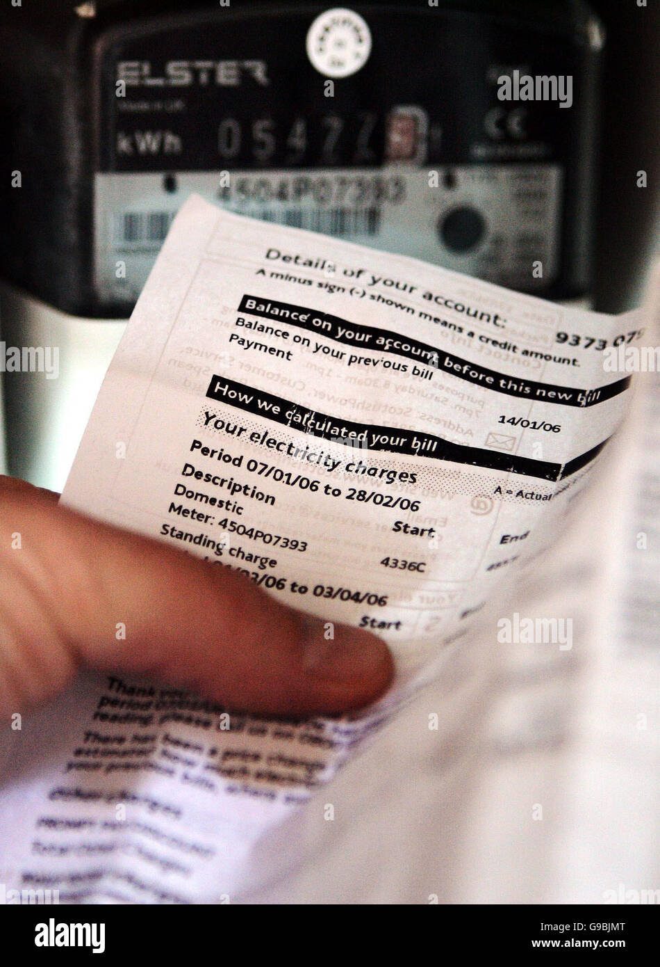 A posed picture of a person checking a recent Scottish Power